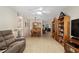 Open-concept living room with lots of natural light and a dining area at 9290 Sw 89Th Ter # D, Ocala, FL 34481