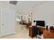 Open-concept living area with a view of the living room and dining area and an office space at 9290 Sw 89Th Ter # D, Ocala, FL 34481
