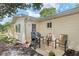 Cozy back patio area featuring a grill and comfortable seating, perfect for outdoor entertaining at 9290 Sw 89Th Ter # D, Ocala, FL 34481