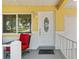 Welcoming porch featuring comfortable seating and delightful front door at 9290 Sw 89Th Ter # D, Ocala, FL 34481