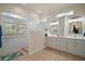 Luxurious bathroom with double sinks, custom shower, and natural light at 9459 Se 124Th Loop, Summerfield, FL 34491
