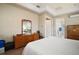 Bright bedroom features wood floors, tray ceiling, and traditional furnishings at 9459 Se 124Th Loop, Summerfield, FL 34491