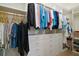 Organized walk-in closet featuring custom shelving, drawers, and ample hanging space at 9459 Se 124Th Loop, Summerfield, FL 34491