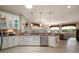 Spacious kitchen with stainless steel appliances, granite countertops, and an open floor plan at 9459 Se 124Th Loop, Summerfield, FL 34491