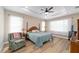 Serene bedroom with tray ceiling, soft lighting, and comfortable furnishings at 9607 Sw 79Th Lane Rd, Ocala, FL 34481