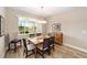 Well-lit dining room features backyard views and modern chandelier at 9607 Sw 79Th Lane Rd, Ocala, FL 34481