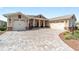 Charming single-story home featuring a brick paved driveway and two-car garage in a well manicured yard at 9607 Sw 79Th Lane Rd, Ocala, FL 34481