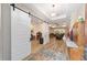 Bright and spacious foyer with an open floor plan and decorative sliding barn door at 9607 Sw 79Th Lane Rd, Ocala, FL 34481