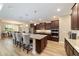 Gourmet kitchen features stainless appliances, an island with seating, and dark cabinets at 9607 Sw 79Th Lane Rd, Ocala, FL 34481