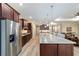 Modern kitchen with stainless appliances, granite countertops, and center island seating at 9607 Sw 79Th Lane Rd, Ocala, FL 34481