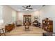 Cozy living room area with vintage furniture, hardwood floors, and a collection display at 9607 Sw 79Th Lane Rd, Ocala, FL 34481