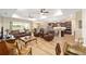 Open concept living room flowing into the kitchen, featuring wood floors and modern finishes at 9607 Sw 79Th Lane Rd, Ocala, FL 34481