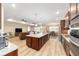 Open living space with kitchen, dining, and living areas, wood flooring, and modern design at 9607 Sw 79Th Lane Rd, Ocala, FL 34481