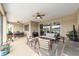 Relaxing screened-in porch with seating, dining area, and a view of the beautifully landscaped backyard at 9607 Sw 79Th Lane Rd, Ocala, FL 34481
