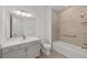 Modern bathroom featuring a tiled shower and a stylish vanity at 9813 Sw 105Th Ct, Ocala, FL 34481