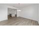 Dining room with light wood-look flooring and a view into the kitchen at 9813 Sw 105Th Ct, Ocala, FL 34481