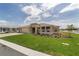 Lovely single-story home enhanced by blue window awnings, a three-car garage, and landscaping at 9813 Sw 105Th Ct, Ocala, FL 34481