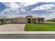 Inviting single-story home boasting a well-manicured lawn and a convenient three-car garage at 9813 Sw 105Th Ct, Ocala, FL 34481