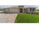 Attractive single-story home featuring a lush lawn and a spacious three-car garage at 9813 Sw 105Th Ct, Ocala, FL 34481