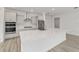 Modern kitchen showcasing stainless steel appliances, quartz countertops, and a kitchen island at 9813 Sw 105Th Ct, Ocala, FL 34481