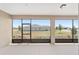 The screened lanai with neutral colors offers outdoor space with views of the well-kept lawn and landscaping at 9813 Sw 105Th Ct, Ocala, FL 34481