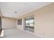 A view of the outdoor lanai that features tile flooring, recessed lighting and a sliding glass door at 9813 Sw 105Th Ct, Ocala, FL 34481