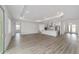 Open-concept living area with recessed lighting, light wood floors, and seamless flow to the kitchen at 9813 Sw 105Th Ct, Ocala, FL 34481