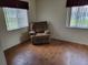 Cozy bedroom featuring wood-look flooring, natural light, and a relaxing atmosphere at 10269 Sw 63Rd Ave, Ocala, FL 34476