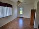 Wood-look floors and natural light illuminate this adaptable room ready for furniture and decor at 10269 Sw 63Rd Ave, Ocala, FL 34476
