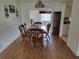 Dining room featuring wood floors, decorative lighting, and plenty of room for Gathering and guests at 10269 Sw 63Rd Ave, Ocala, FL 34476