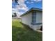 Side exterior view of the home with landscaping along the foundation at 10269 Sw 63Rd Ave, Ocala, FL 34476