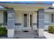 Charming covered front porch with decorative pillars and welcoming entrance at 10269 Sw 63Rd Ave, Ocala, FL 34476