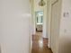 Hallway with tile flooring and a view into an adjacent bathroom at 10269 Sw 63Rd Ave, Ocala, FL 34476