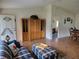Cozy living room with wood flooring, built-in shelving and views of the entrance and dining area at 10269 Sw 63Rd Ave, Ocala, FL 34476