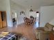 Spacious living room and dining area featuring wood floors and an open layout for easy entertaining at 10269 Sw 63Rd Ave, Ocala, FL 34476