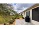 Well-manicured backyard featuring a grill, patio, and tropical landscaping at 10287 Sw 96Th Ln, Ocala, FL 34481