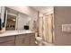 Well-lit bathroom with modern vanity, neutral walls, and decorative shower curtain adds style to this relaxing space at 10287 Sw 96Th Ln, Ocala, FL 34481