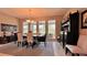 Open dining room with a view and plenty of room for the whole Gathering at 10287 Sw 96Th Ln, Ocala, FL 34481