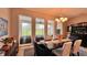 Open dining room with a view and easy access to the screened in outdoor patio at 10287 Sw 96Th Ln, Ocala, FL 34481
