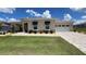 The home has a well manicured front yard and brick accents for a luxurious look at 10287 Sw 96Th Ln, Ocala, FL 34481