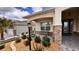 Inviting front porch with stone accents, a brick walkway, a lamp post and seating at 10287 Sw 96Th Ln, Ocala, FL 34481