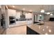 Gourmet kitchen with stainless steel appliances and a mosaic tile backsplash design at 10287 Sw 96Th Ln, Ocala, FL 34481