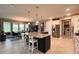 Beautiful kitchen island with bar stool seating with stainless steel appliances at 10287 Sw 96Th Ln, Ocala, FL 34481