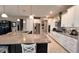 Modern kitchen with granite counters, tile backsplash and stainless steel appliances at 10287 Sw 96Th Ln, Ocala, FL 34481