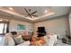 Open living room with recessed lighting, fan, large sofas and decorative accent chairs at 10287 Sw 96Th Ln, Ocala, FL 34481