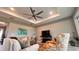 Open living room with recessed lighting, fan, large sofas and decorative accent chairs at 10287 Sw 96Th Ln, Ocala, FL 34481