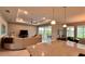 Spacious living room featuring large sofas, recessed lighting, and access to outdoor spaces at 10287 Sw 96Th Ln, Ocala, FL 34481