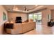 Spacious living room featuring large sofas, recessed lighting, and access to outdoor spaces at 10287 Sw 96Th Ln, Ocala, FL 34481
