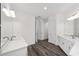 Elegant bathroom featuring double sinks, modern vanities, and stylish mirrors for a touch of luxury at 10553 Sw 98Th Pl, Ocala, FL 34481
