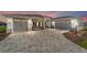 Charming two-car garage home with stone driveway, manicured garden, and welcoming curb appeal at 10553 Sw 98Th Pl, Ocala, FL 34481